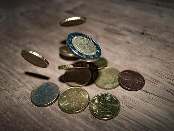 close-up-of-coins-on-table-332304